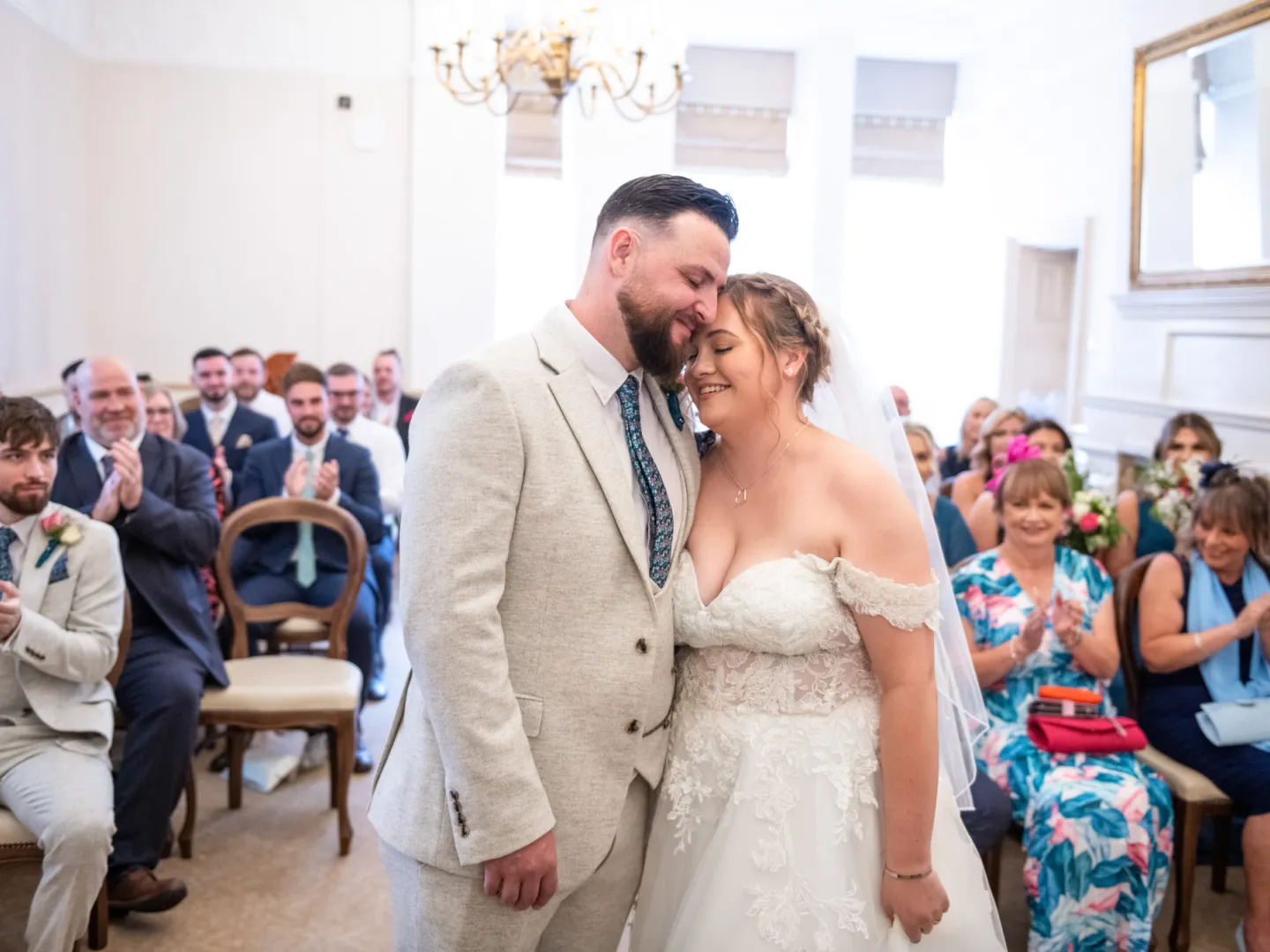 A couple having a cuddle after getting married