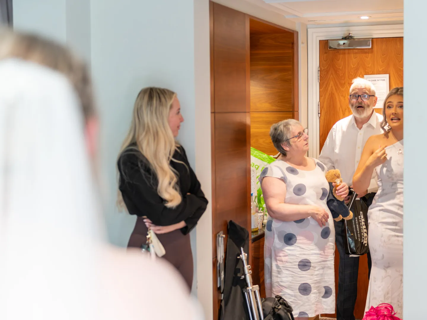Father of the bride seeing his daughter in her dress