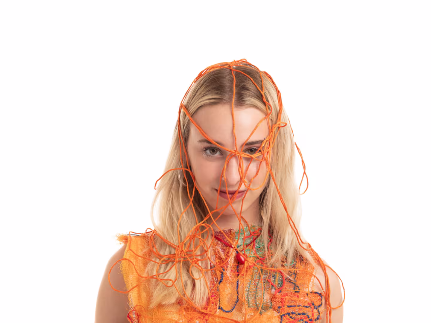 Woman with bright coloured string over her head