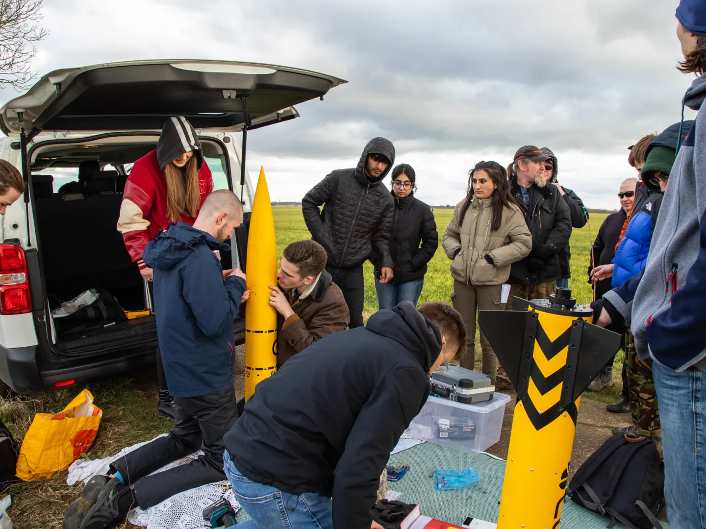 Leeds rocketry team working in a field