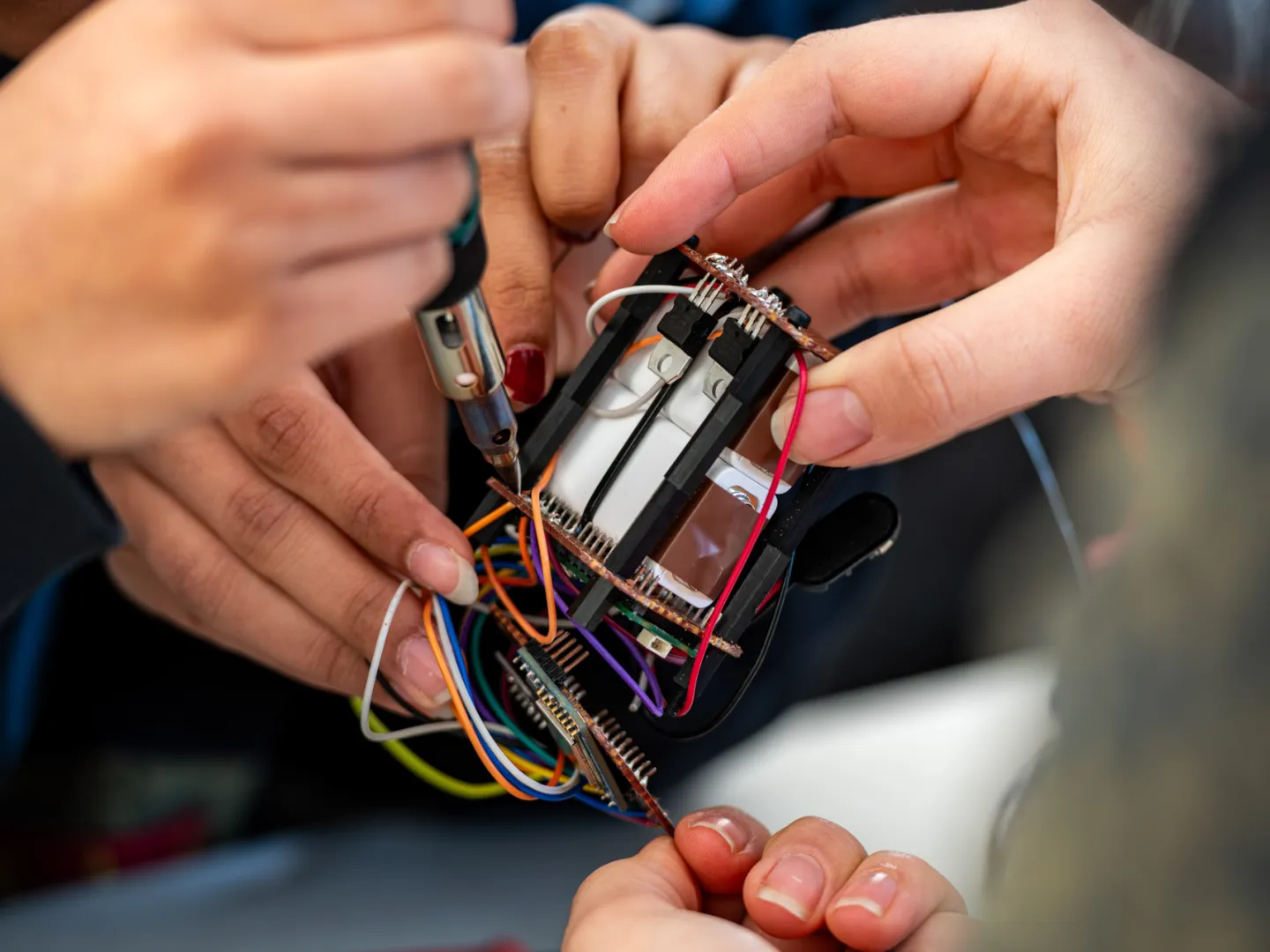 Hands working on electrics