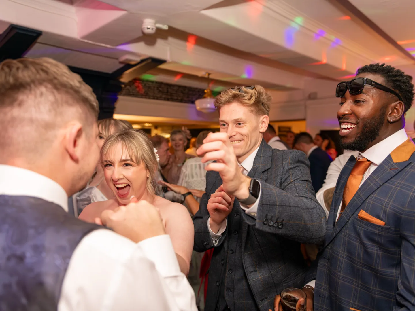 Groomsman praising the groom on the dance floor