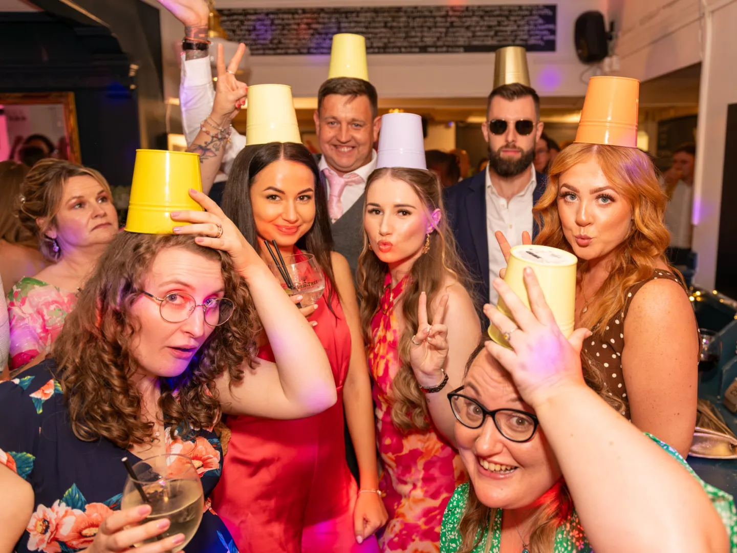Guests group shot with floor pots on heads