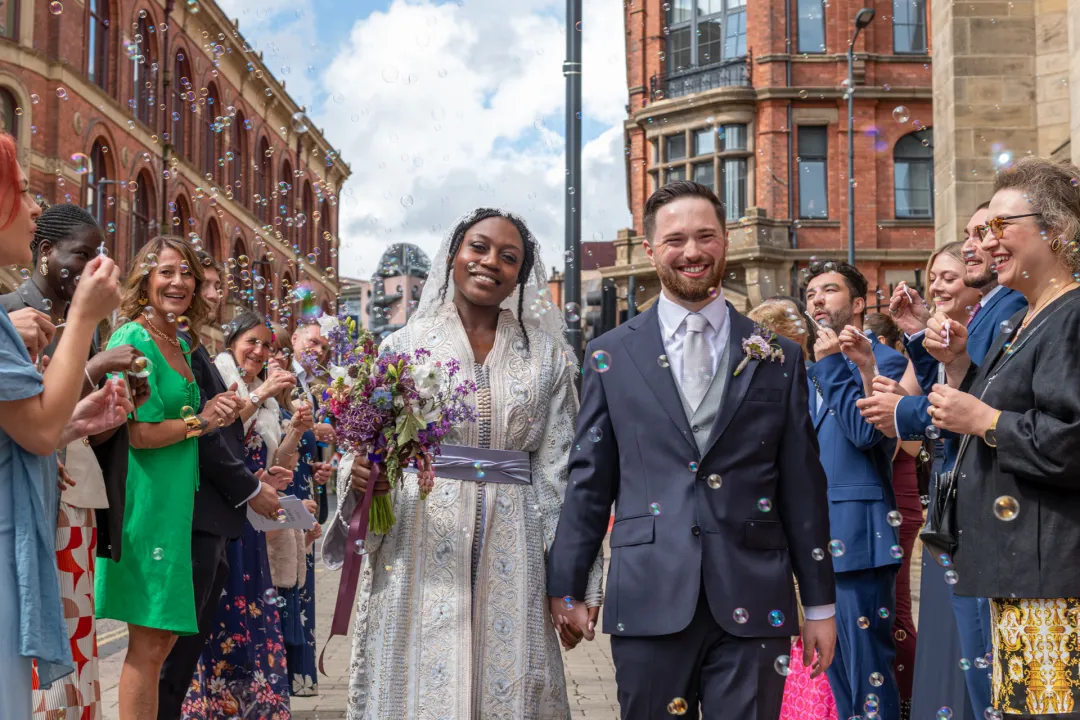 Couple walking through confetti